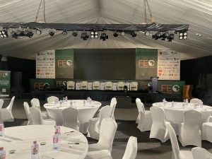 Conference setup with tables and stage