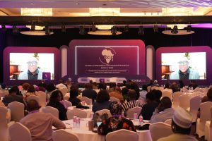 Conference attendees with virtual speaker