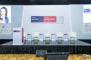 Conference stage with empty chairs
